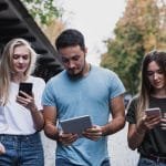group of people looking at datacultr's device locking technology which is an alternative to payjoy