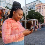 women in kenya using a financed smartphone