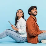 two people happy to get laptops on loan as device lock technology enabled lenders